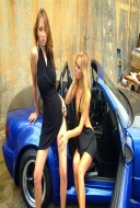 Two sexbombs posing by a sports car - 00
